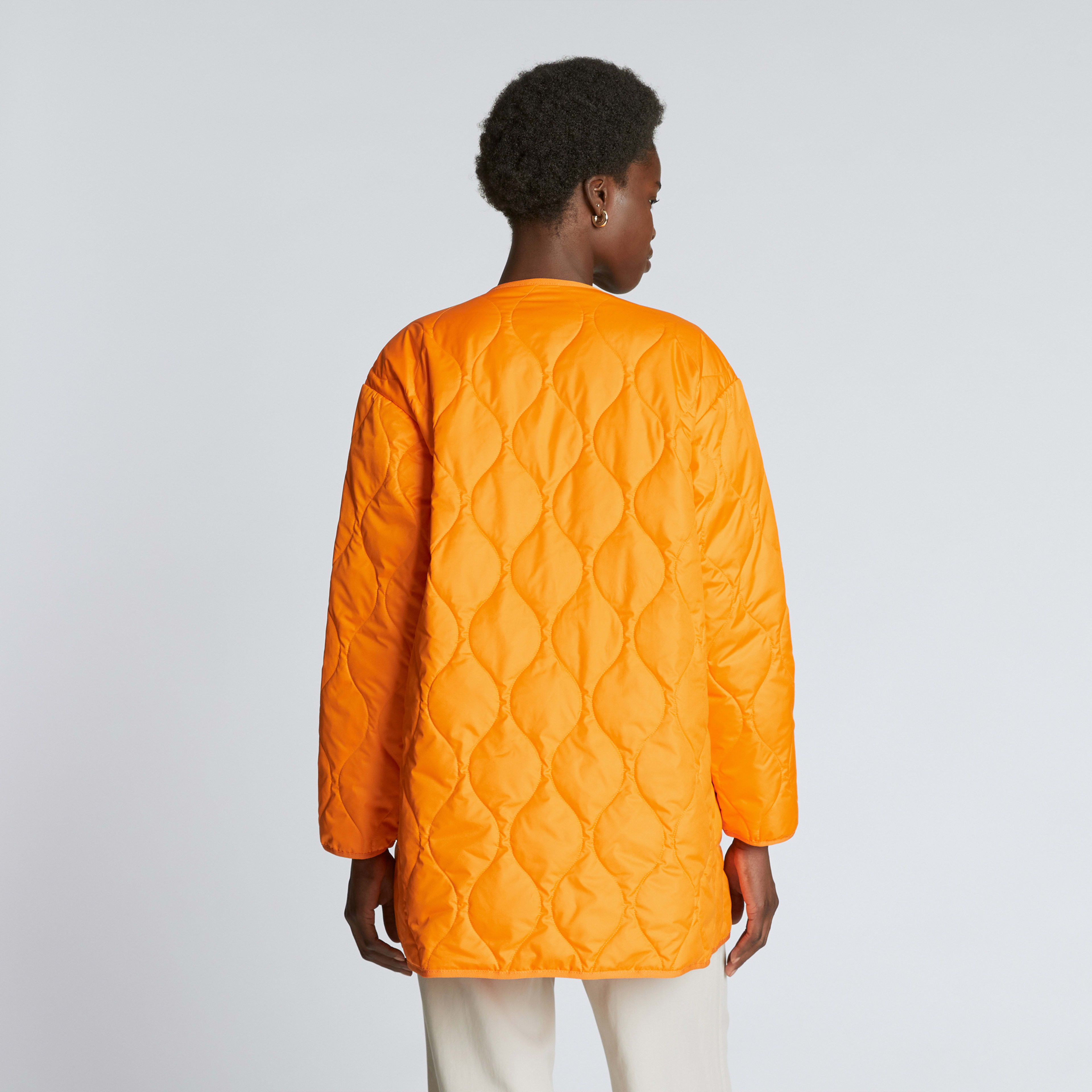 The ReNew Quilted MidLength Liner Turmeric Everlane