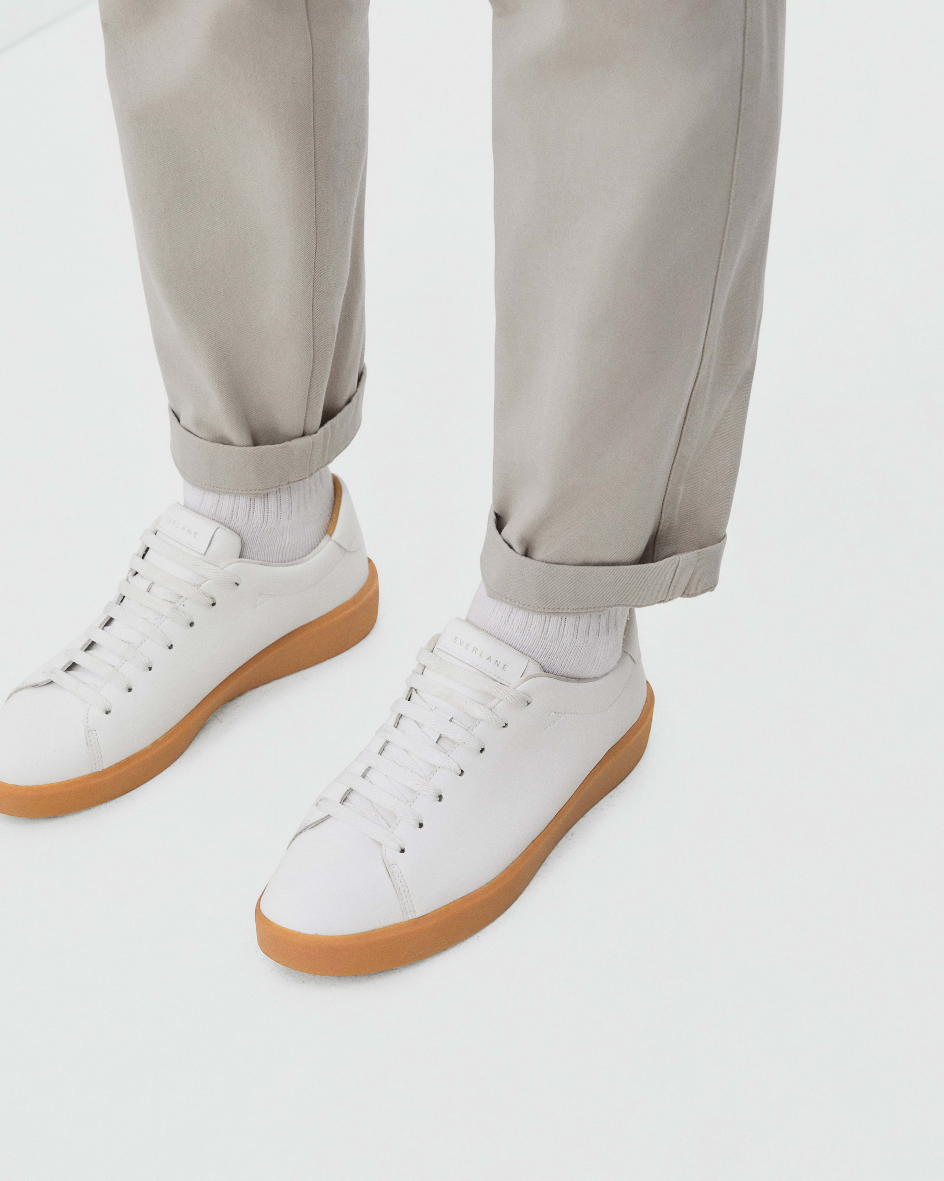 White tennis shoes with gum sole online