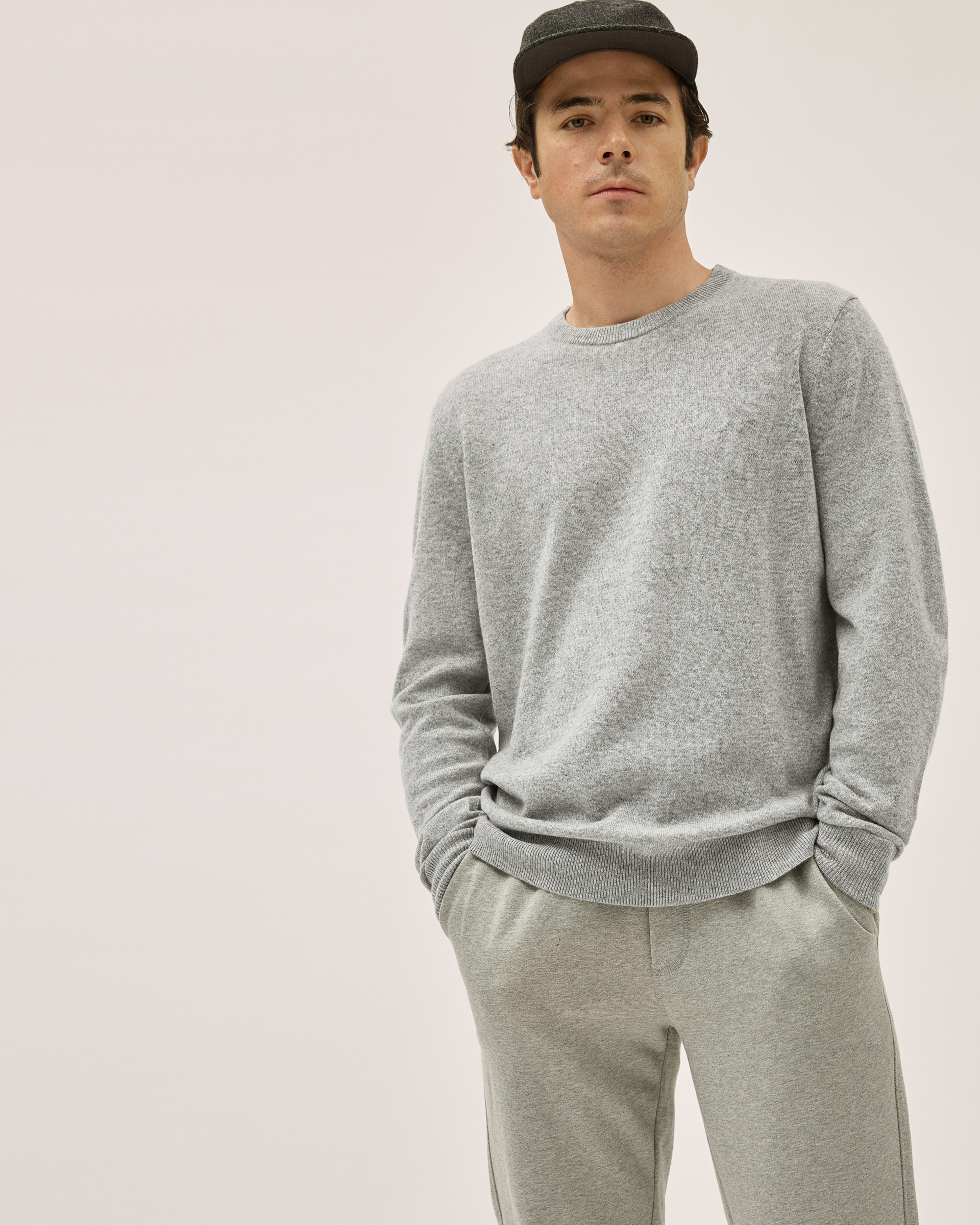 Cozy and Casual: Charcoal Beanie, White T-Shirt, Grey Sweatpants, and  Athletic Shoes