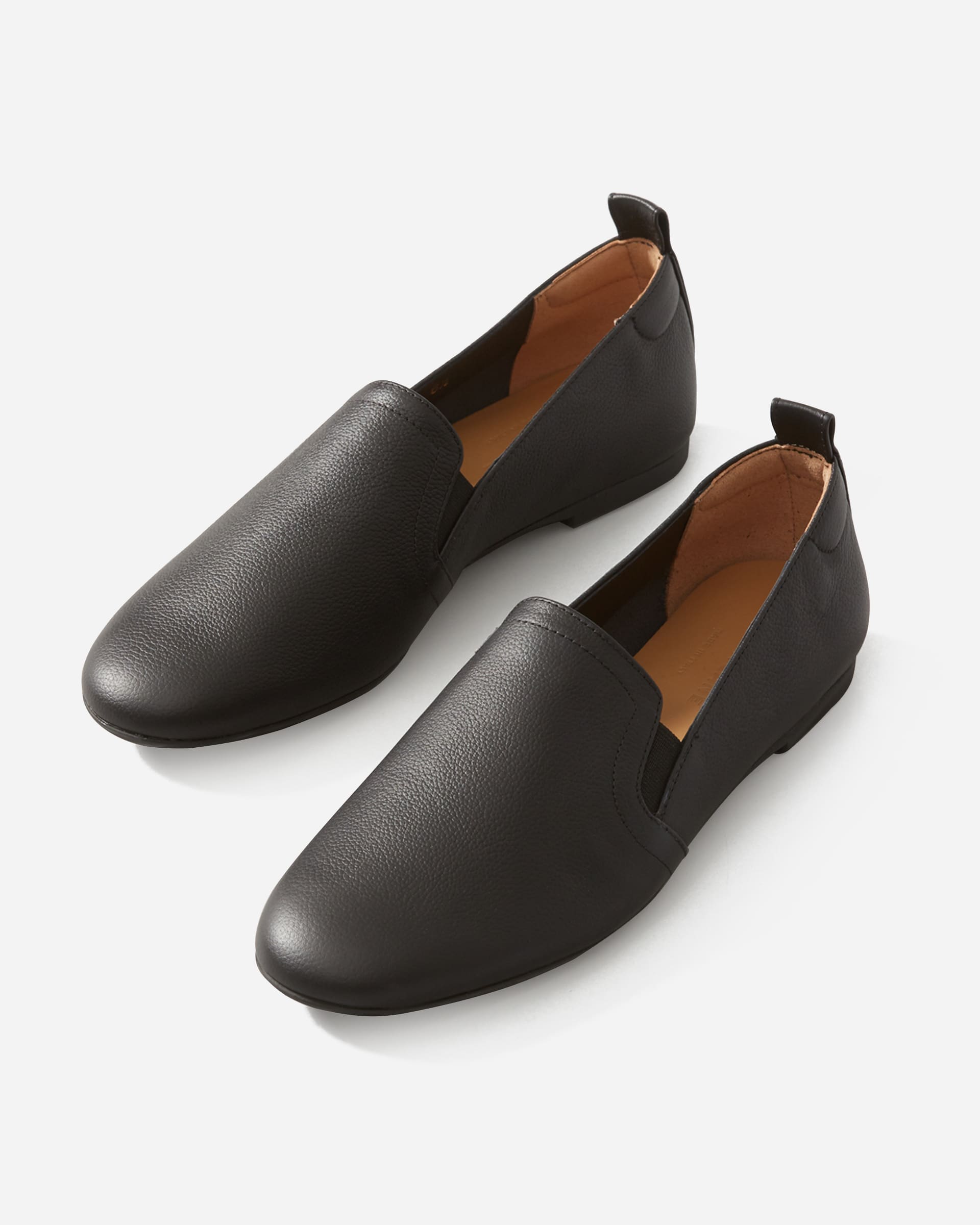 black slip on leather trainers