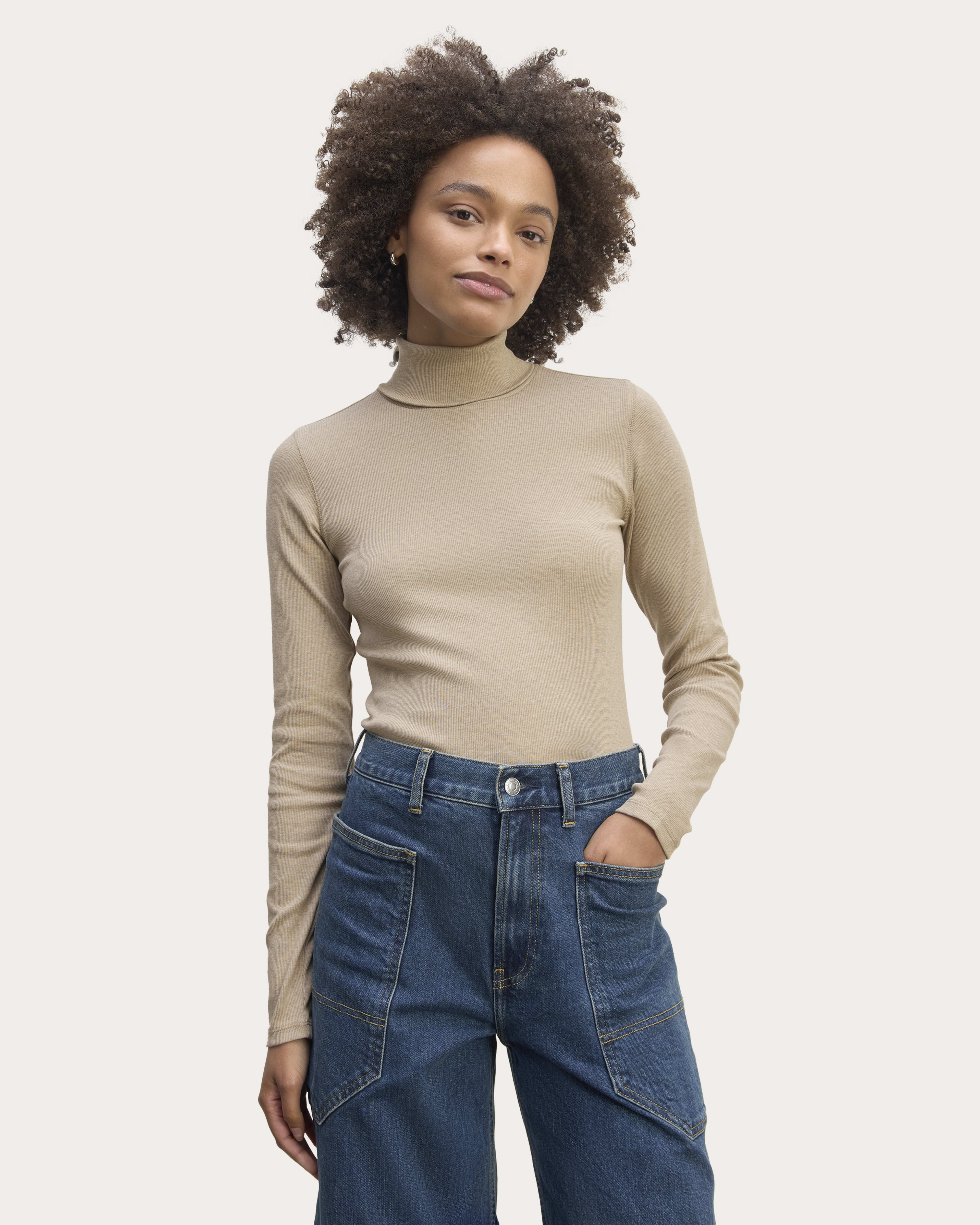Turtleneck and high waisted jeans on sale
