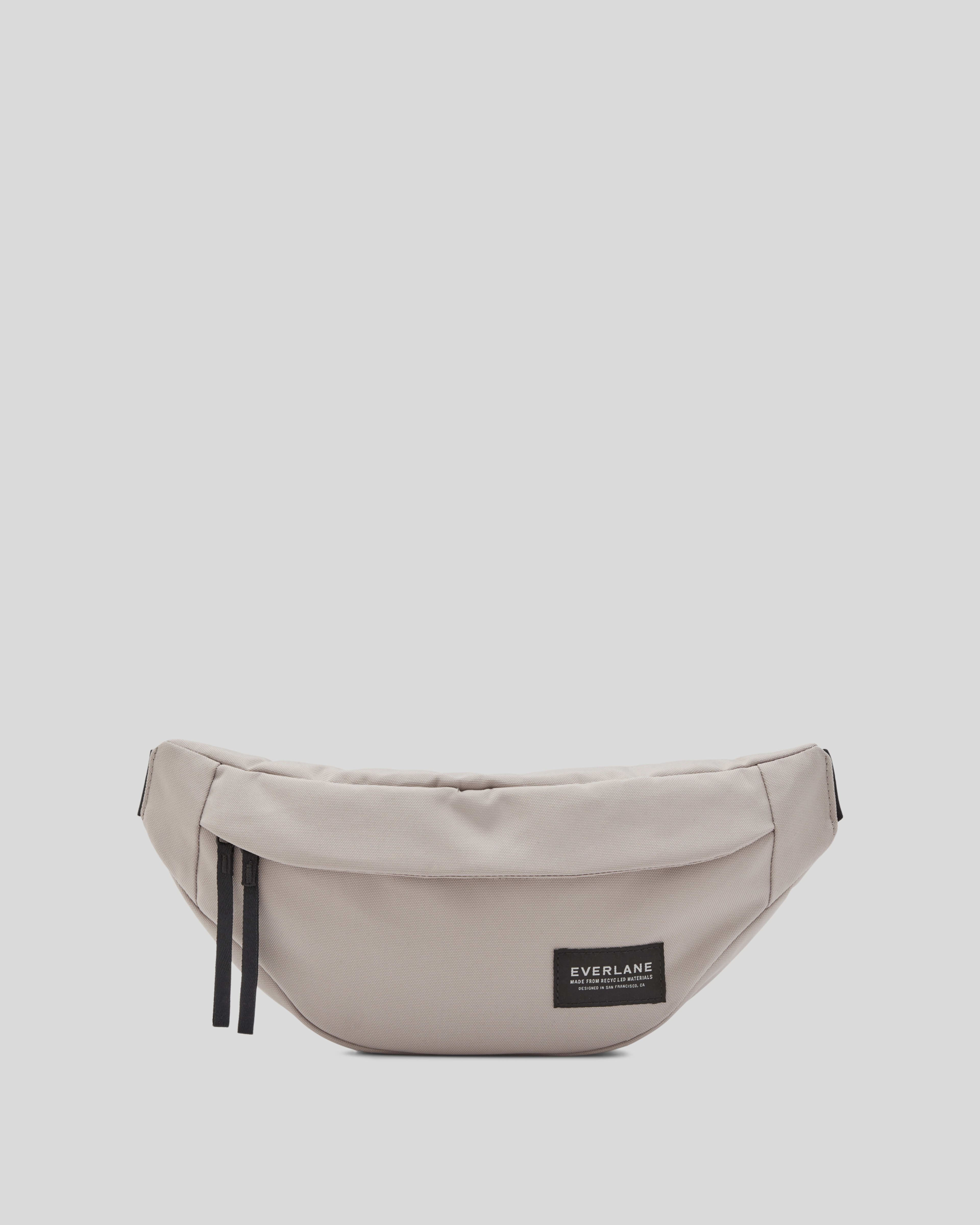 The Renew Transit Fanny Pack Warm Quartz with label Everlane