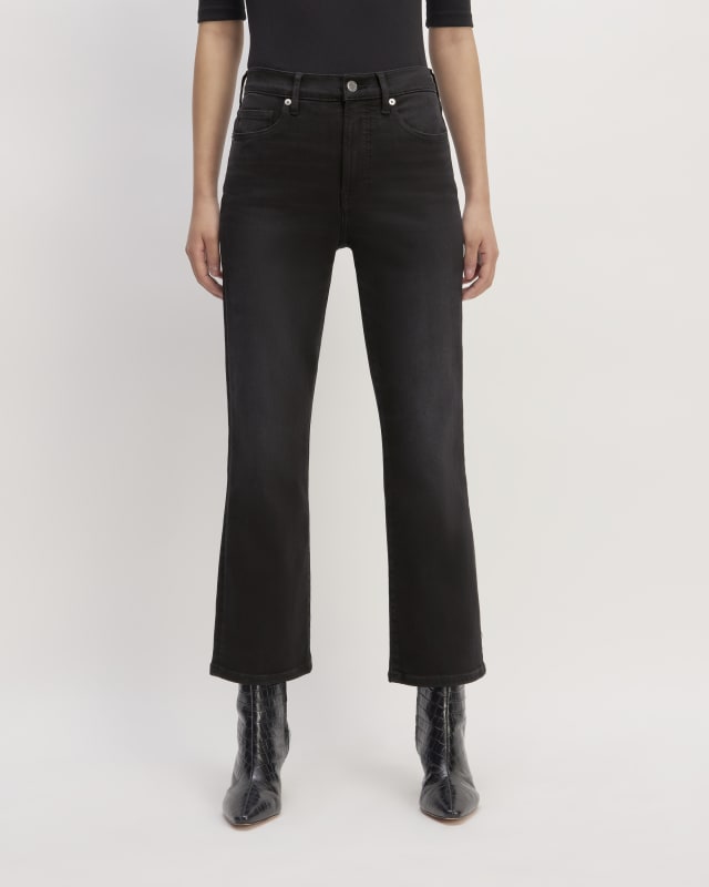 The Kick Bootcut Jean in faded black, paired with plain white tee and black boots
