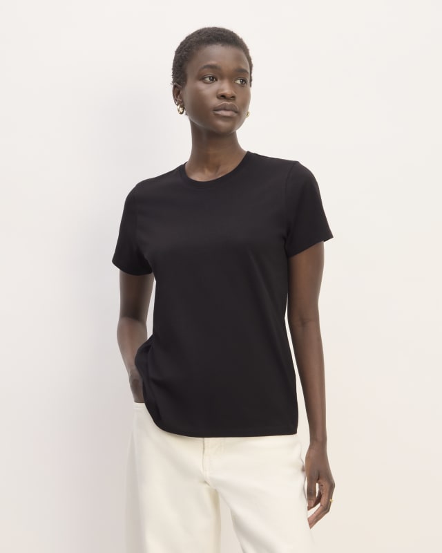 A woman wearing a black T-Shirt
