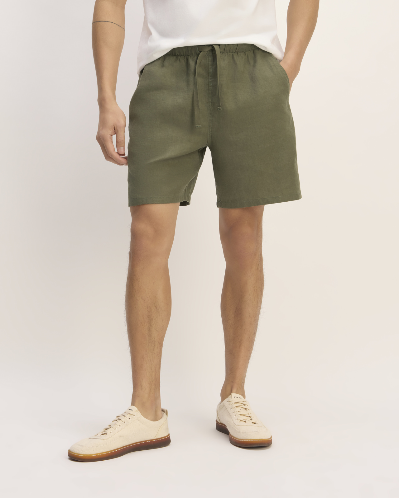A man wearing green shorts