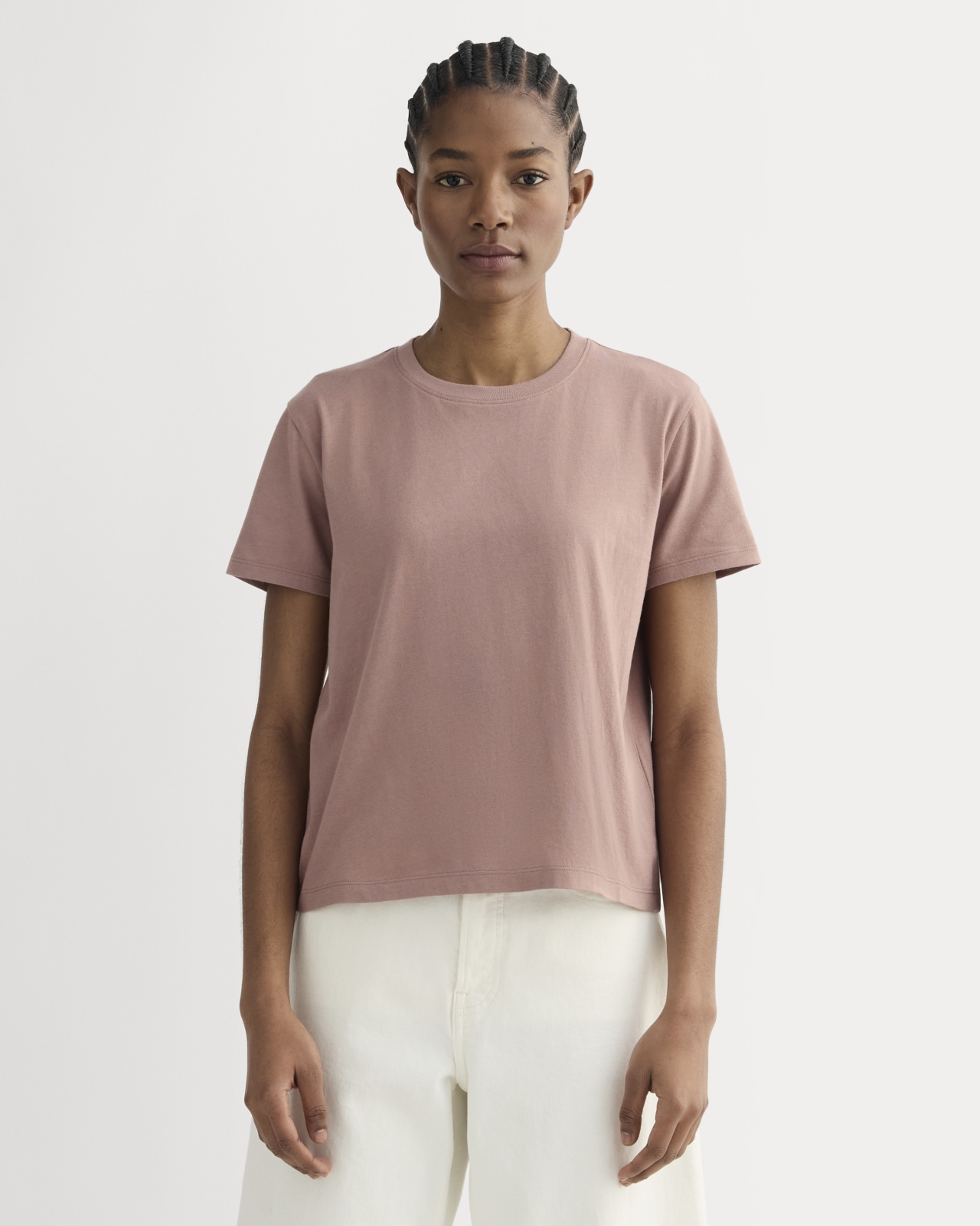 A woman wearing a pink shirt